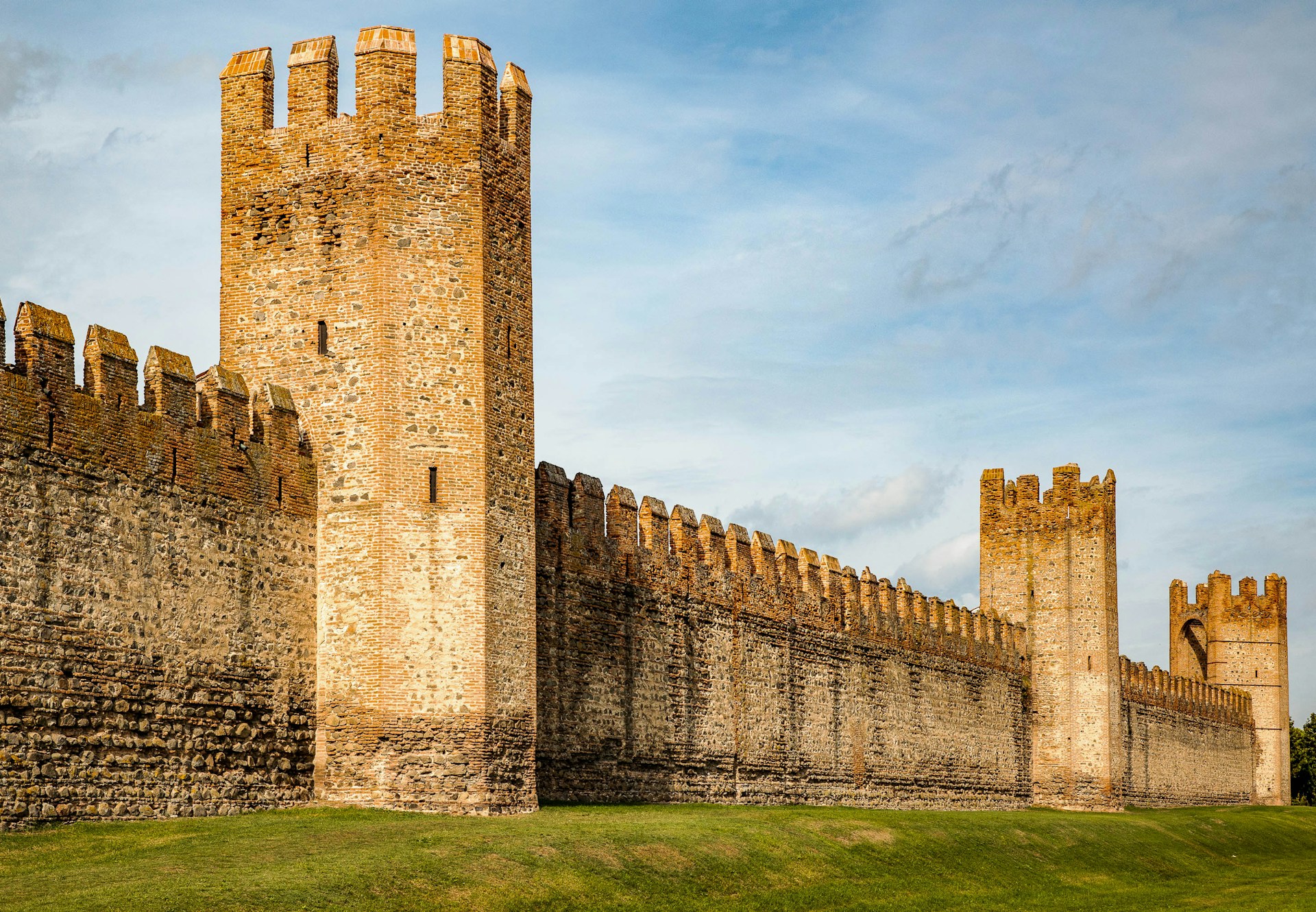 a large castle with two towers on top of it