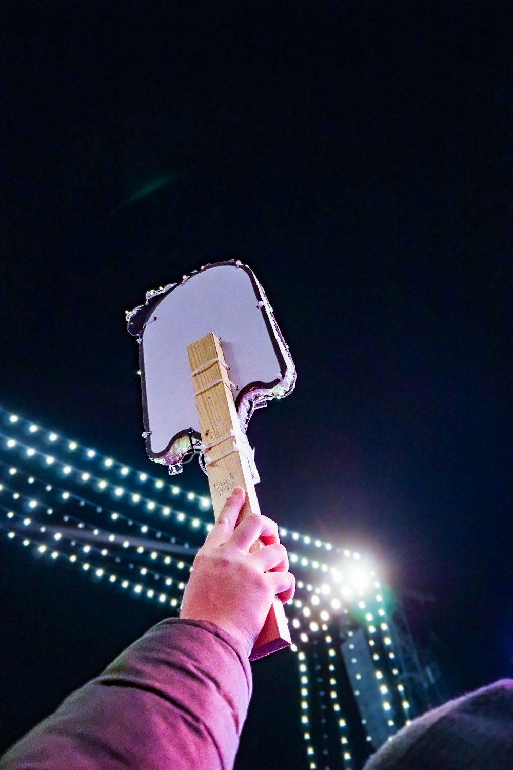 a person holding an ice hockey stick in their hand