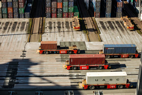 A logistics team preparing vehicles for export at a busy port.