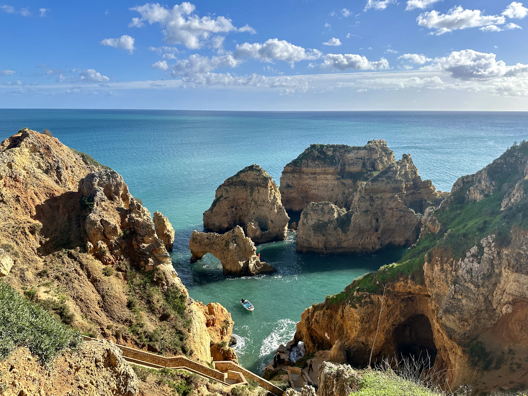 Blue water beside pale cliffs at Ponta da Piedade in the Algarve.