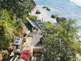 an aerial view of a beach with a solar panel on the roof