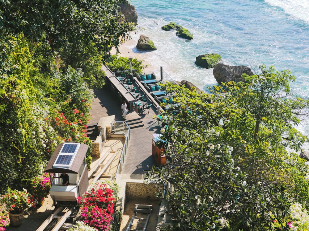 an aerial view of a beach with a solar panel on the roof