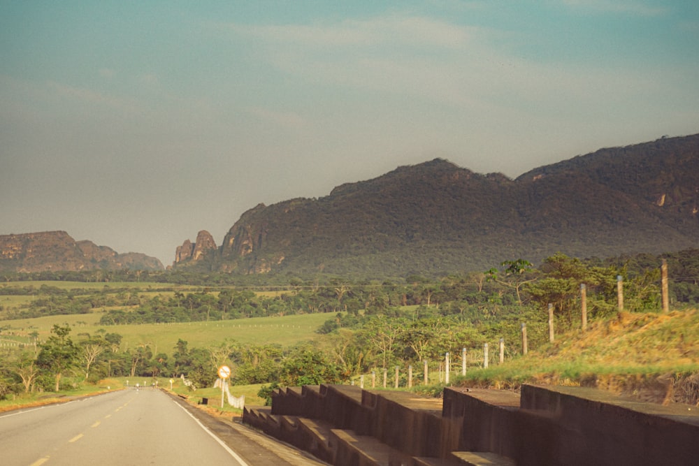 a view of a mountain range from a highway