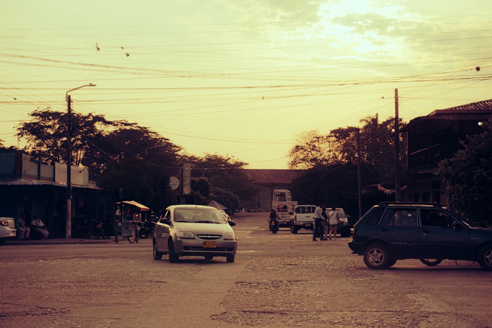 a car driving down a street next to tall buildings