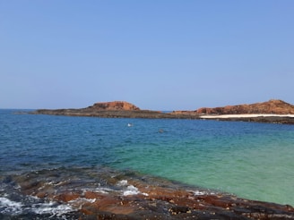 Crystal-clear waters of the Black Sea coastline under a bright summer sky