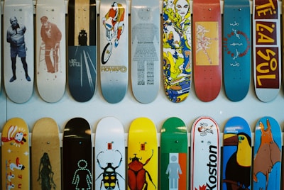 a bunch of skateboards are lined up on a wall