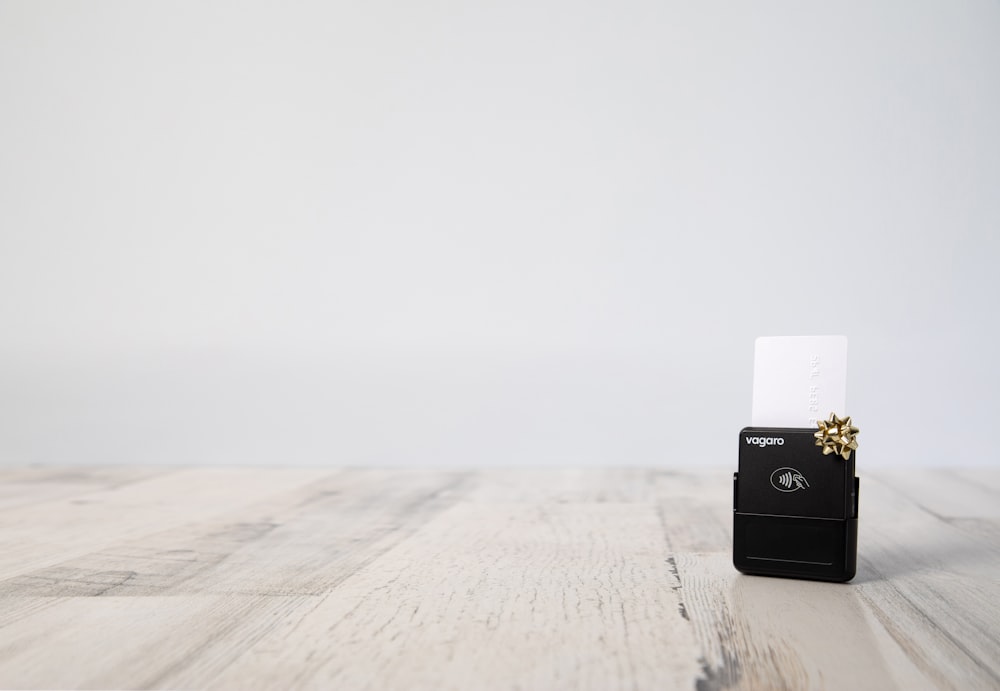 a small business card holder on a wooden table