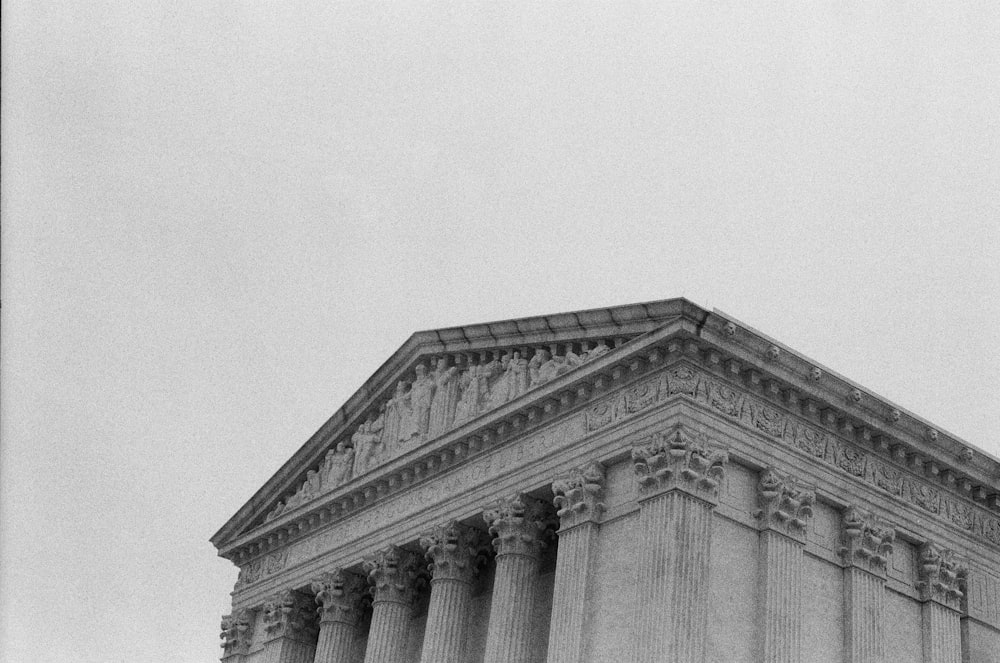 a black and white photo of the supreme court building