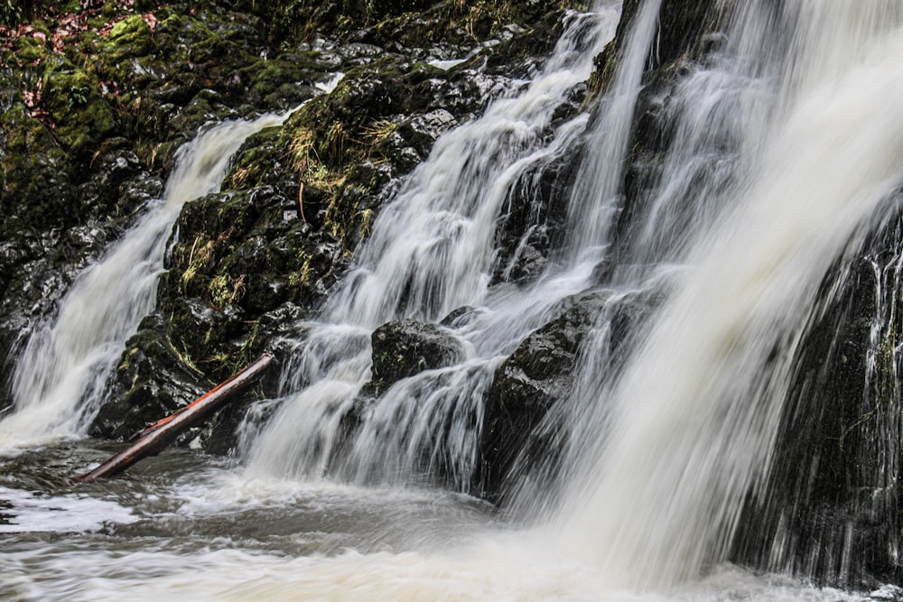 a large waterfall with lots of water coming out of it