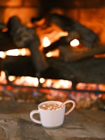 Friends enjoying hot chocolate and popcorn by the fireplace.