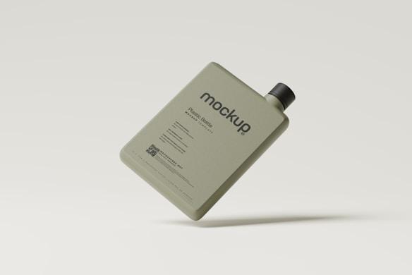A rectangular plastic bottle with a minimalist design, featuring a black cap. The bottle is khaki-colored and is labeled with the word 'mockup' along with additional text indicating it's a plastic bottle. The background is a light cream color, and the bottle appears to be floating.
