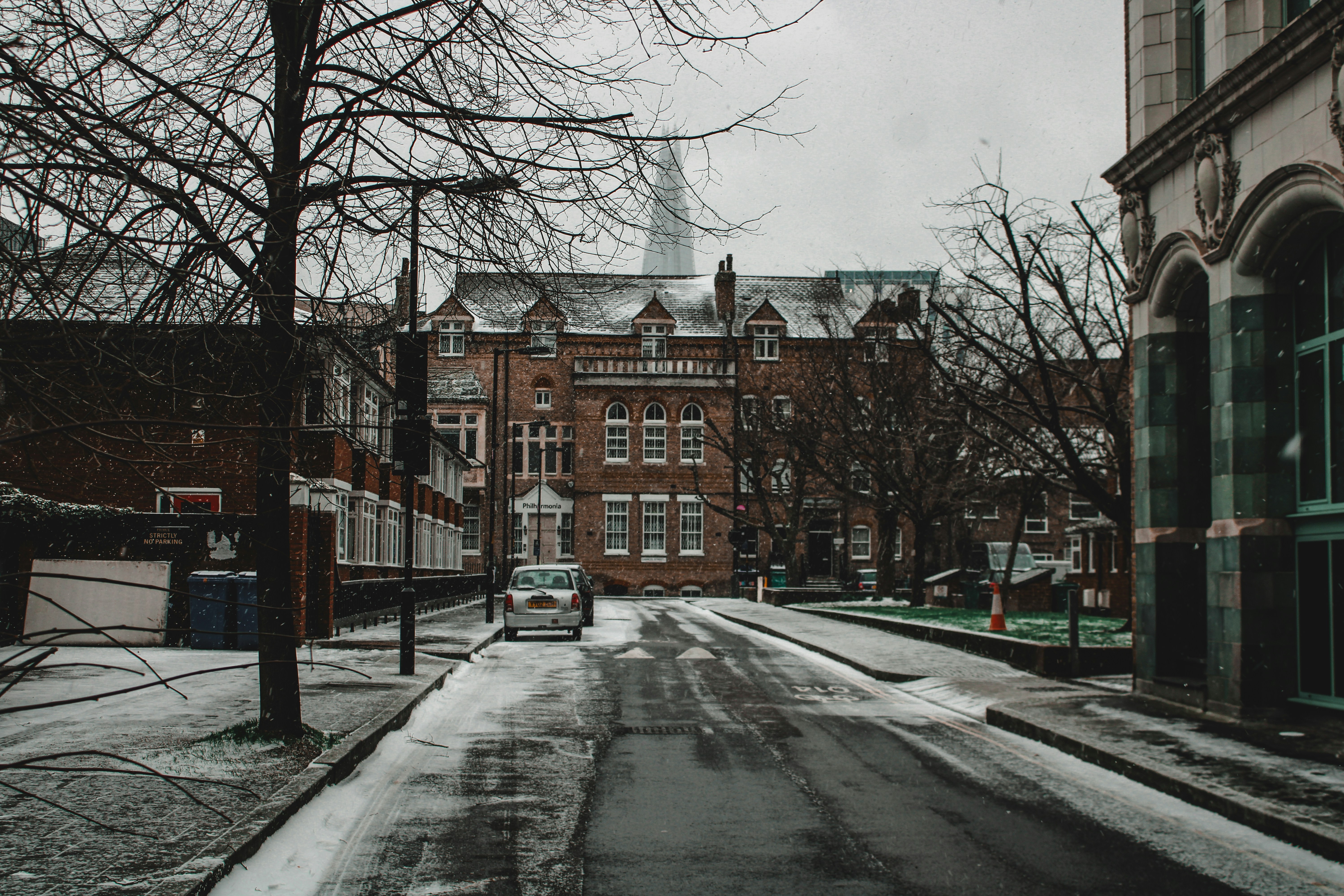a car is parked on a snowy street