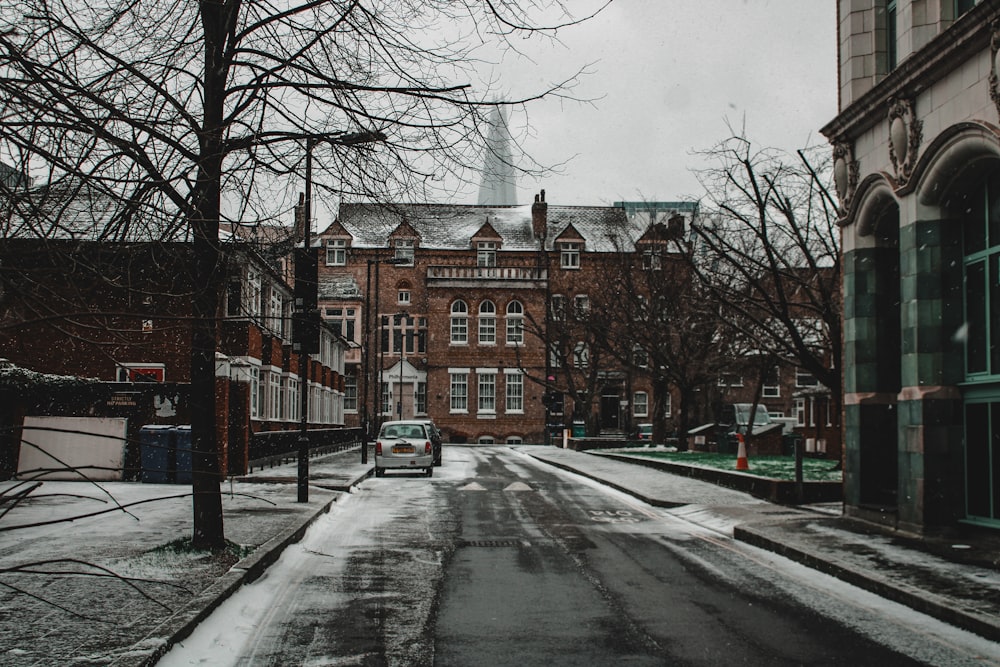 a car is parked on a snowy street