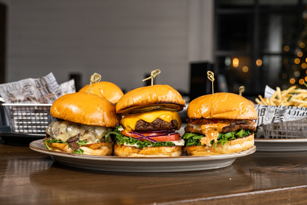 a plate of hamburgers on a table