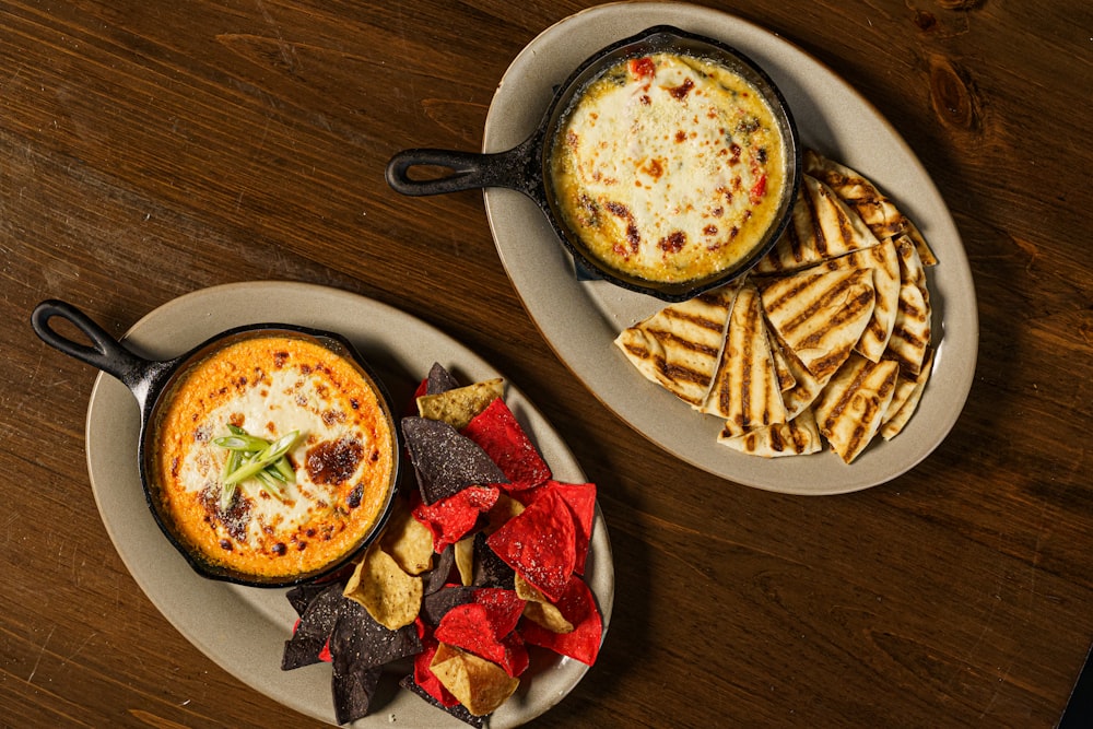 two plates of food on a wooden table