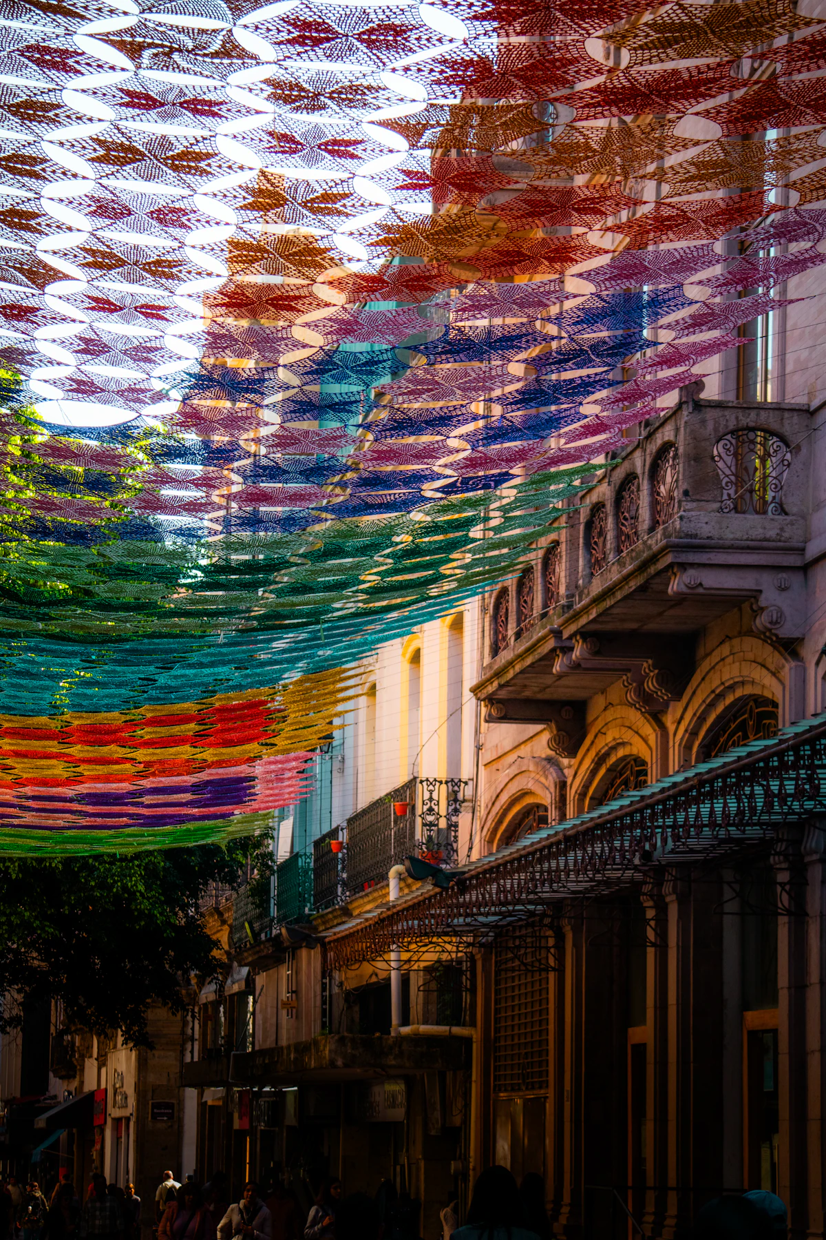 Colorful street in a Mexican beach town with bunting flags and street art