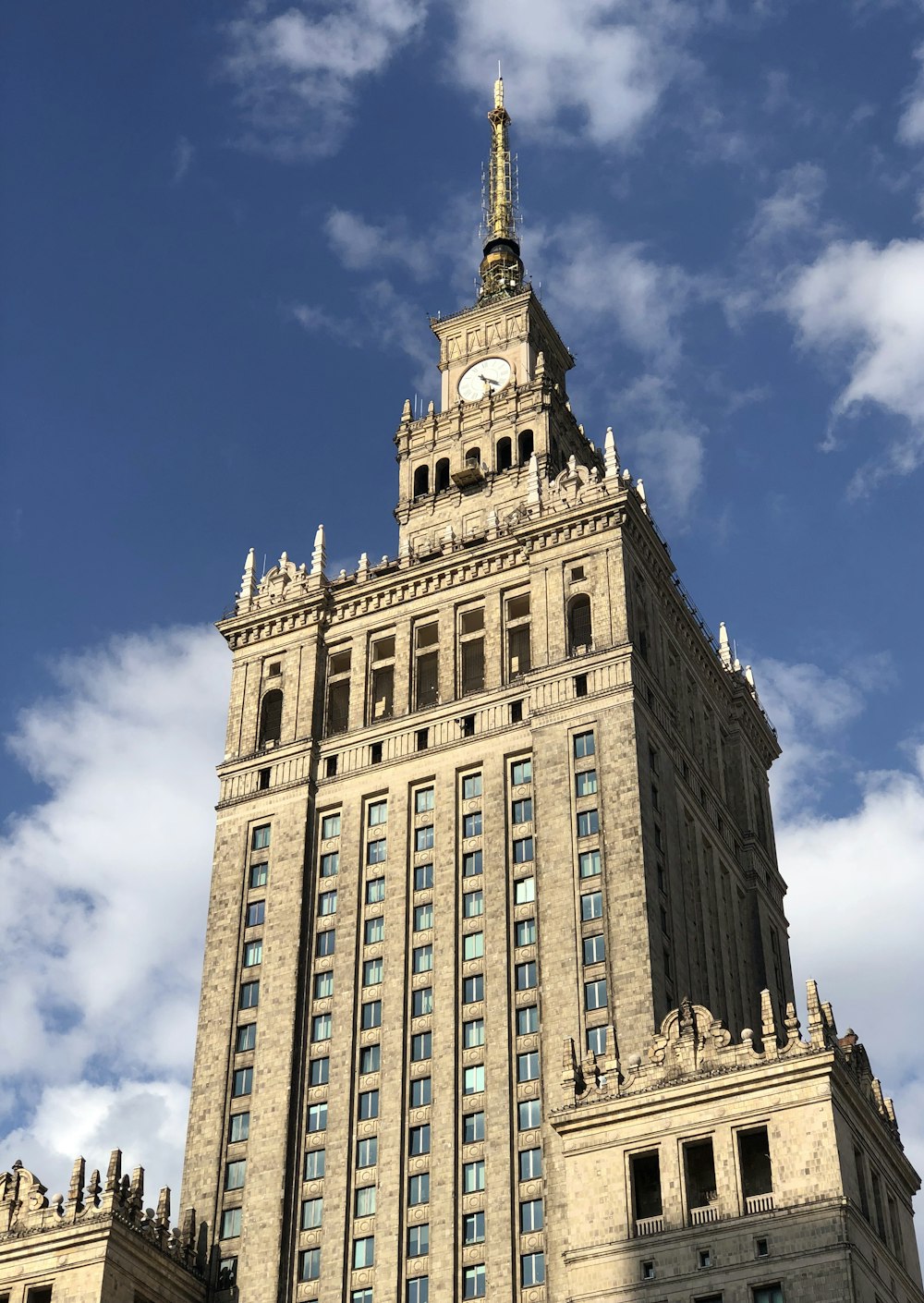 a tall building with a clock on the top of it