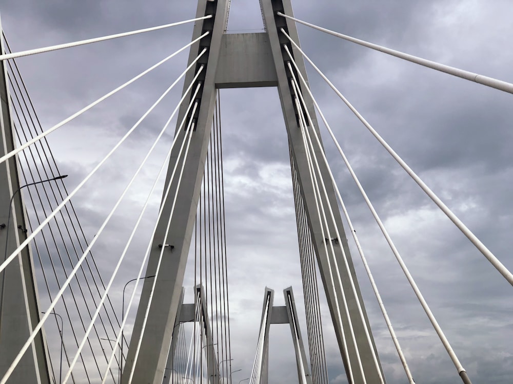 a view of a very tall bridge from the ground