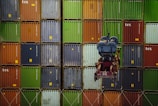 a large stack of colorful shipping containers