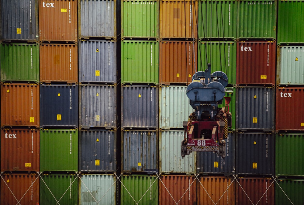 a large stack of colorful shipping containers