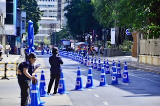 A row of portable barriers lined up for an event in Kuwait City, ready to control pedestrian flow.