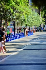 Kids participating in a fun traffic safety game outdoors with colorful cones.