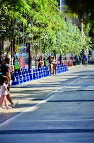 Kids participating in a fun traffic safety game outdoors with colorful cones.