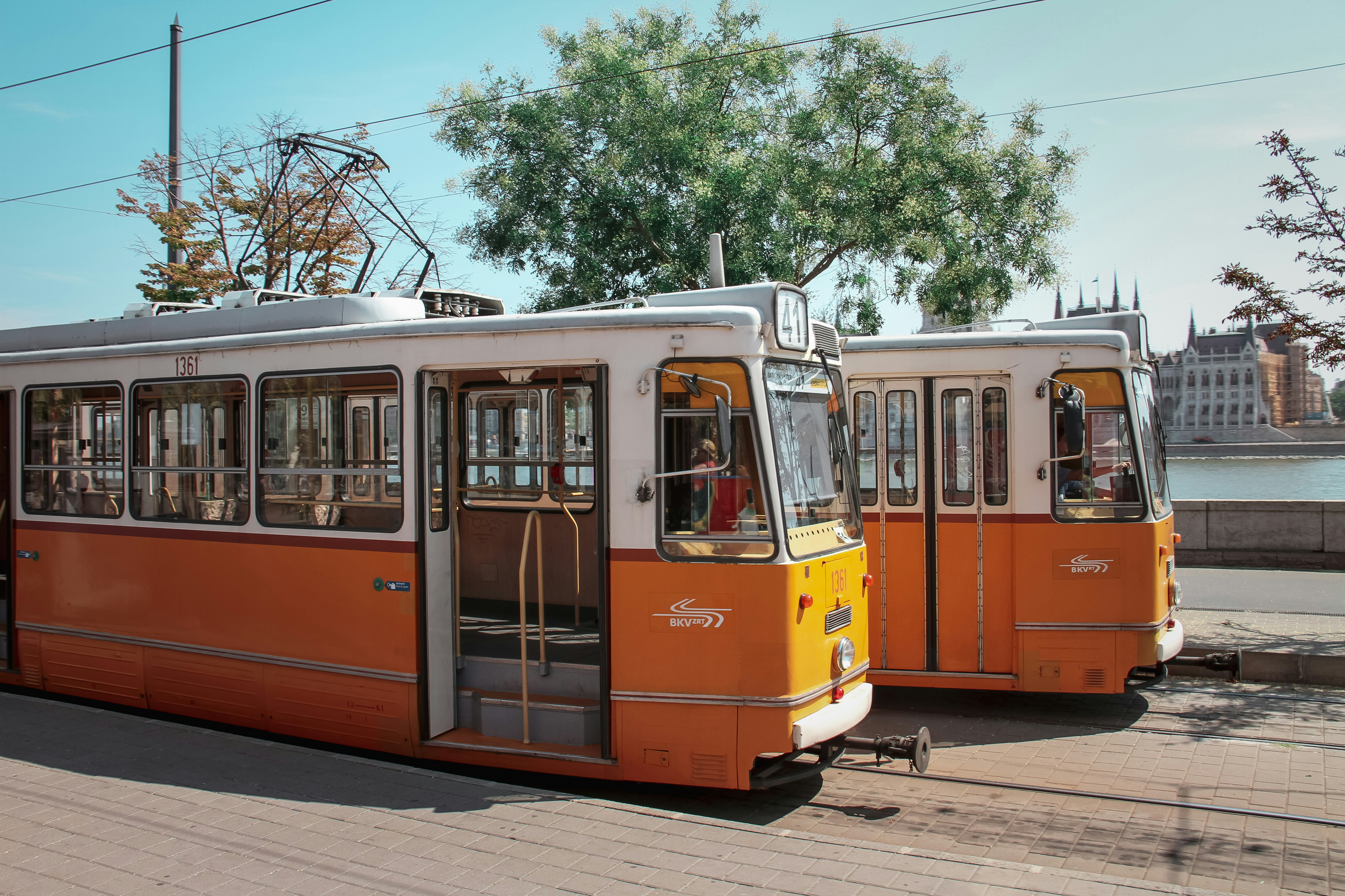 a couple of orange trolleys parked next to each other
