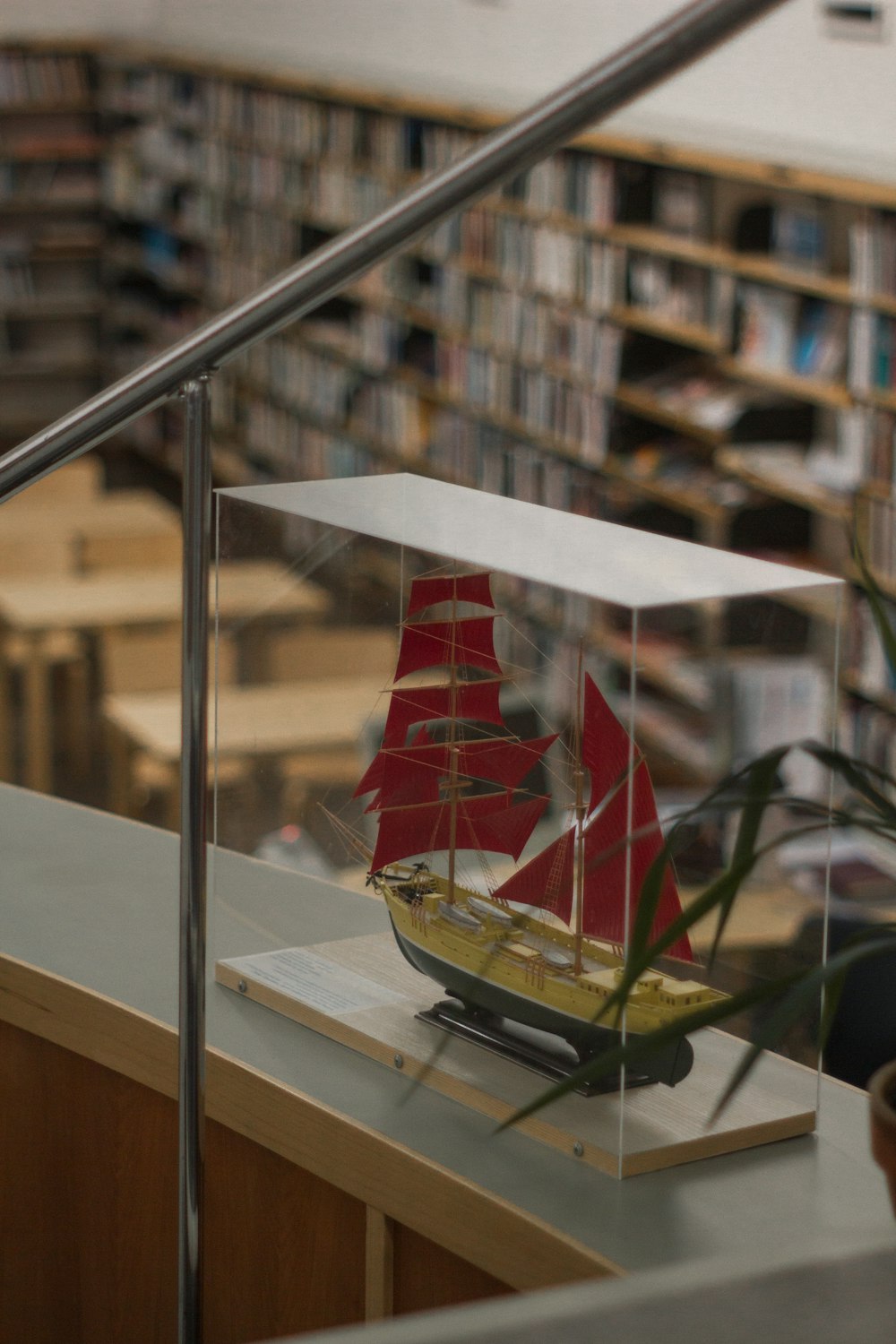 a model of a boat in a glass case