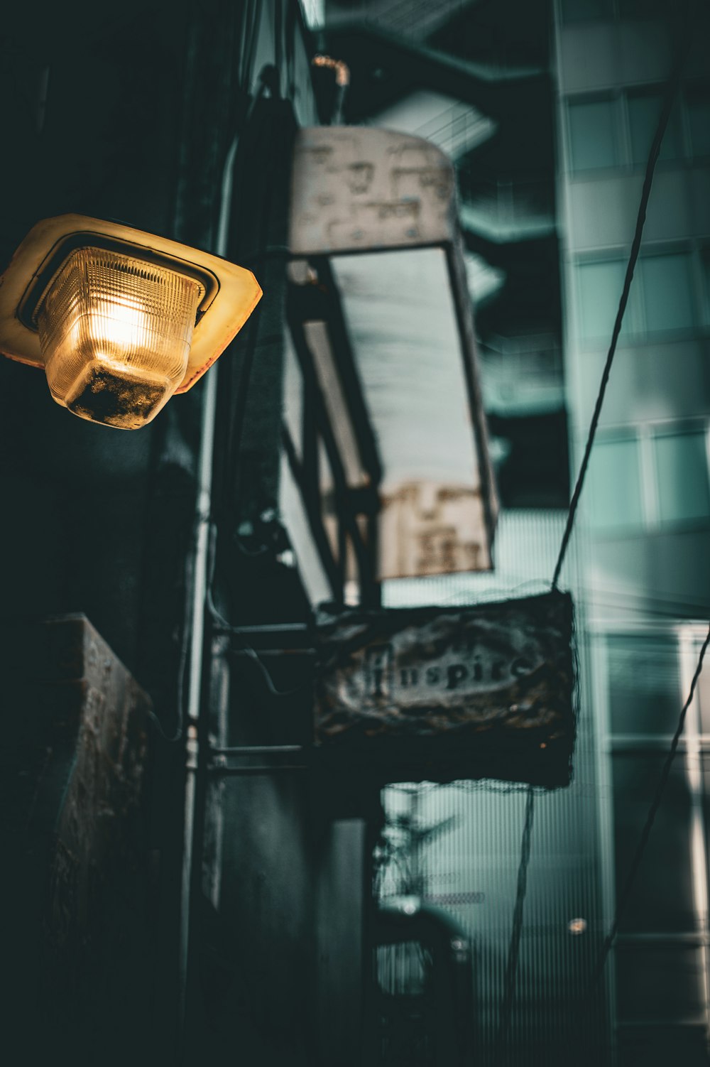 a street light hanging from the side of a building