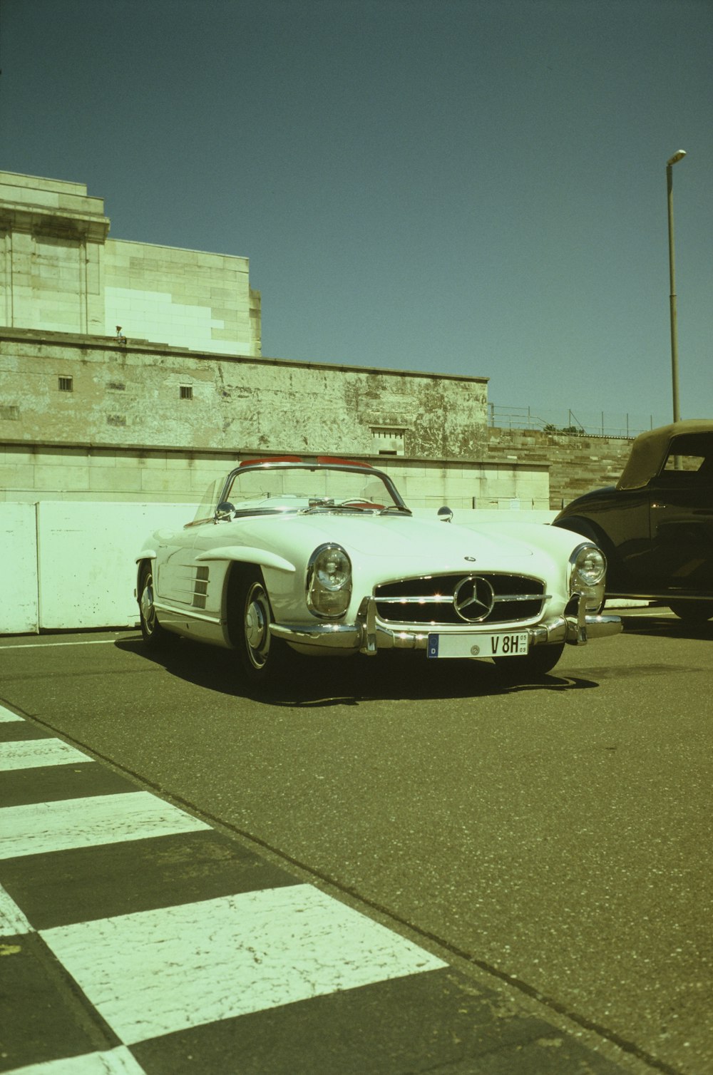 a white car parked on the side of the road