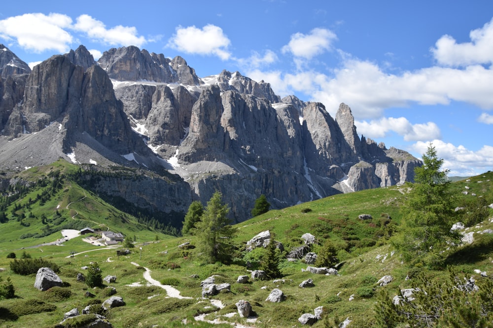 a view of a mountain range with trees and rocks