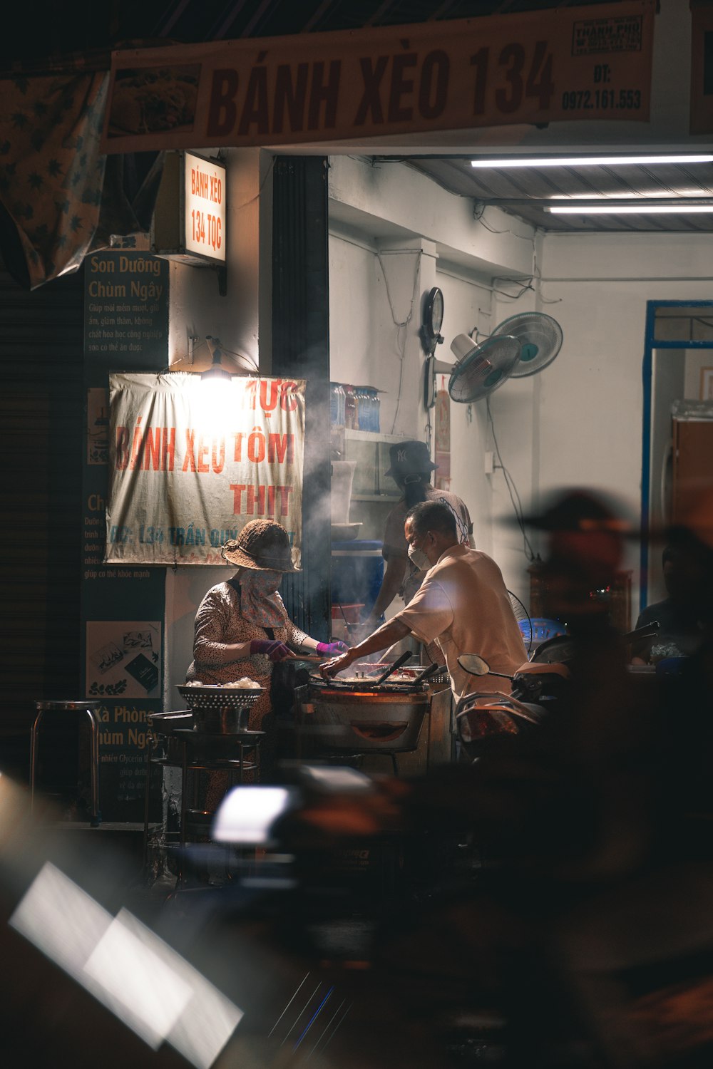 a couple of men sitting at a table in a room