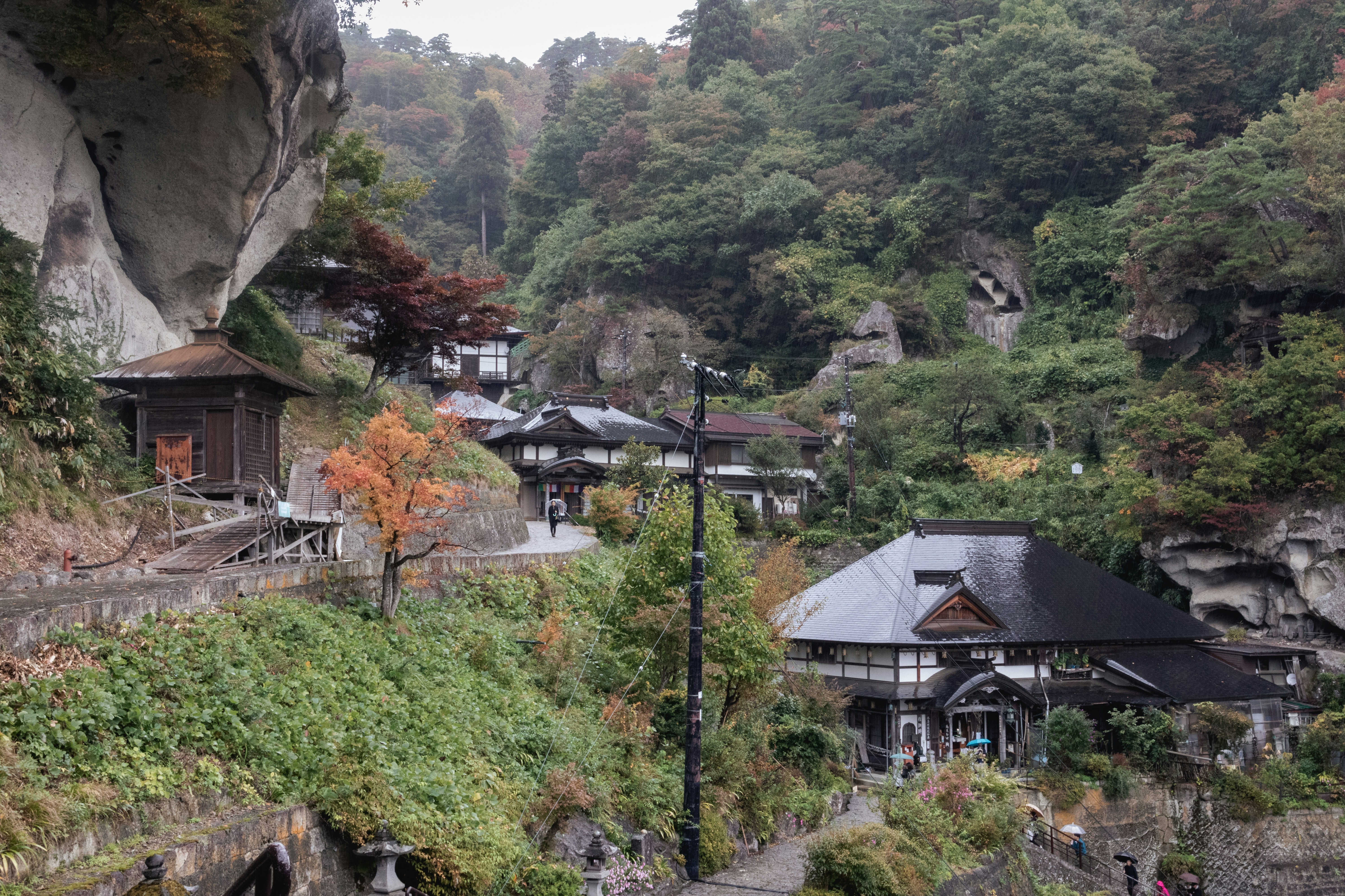 Japanese mountain village with autumn leaves
