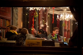 A group of friends enjoying beverages in a cozy restaurant setting.