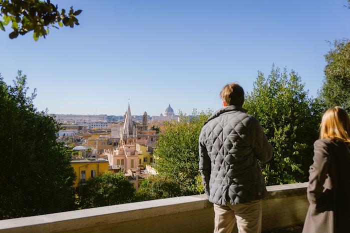 a man and a woman looking out over a city