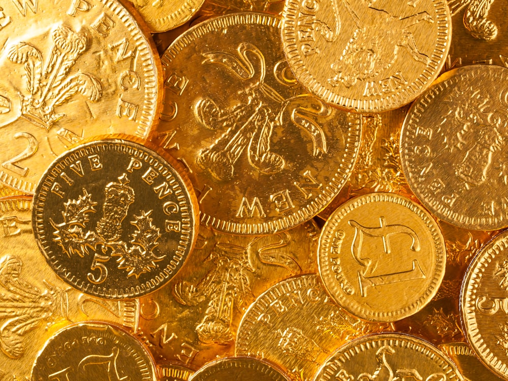 a pile of gold coins sitting on top of each other