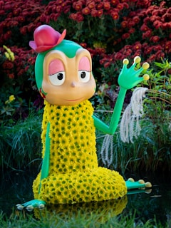 A cheerful cartoon frog wearing a bright t-shirt with a witty saying, sitting on a lily pad.