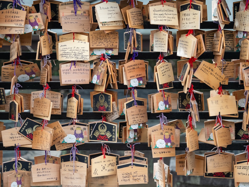 a bunch of tags are hanging on a wall