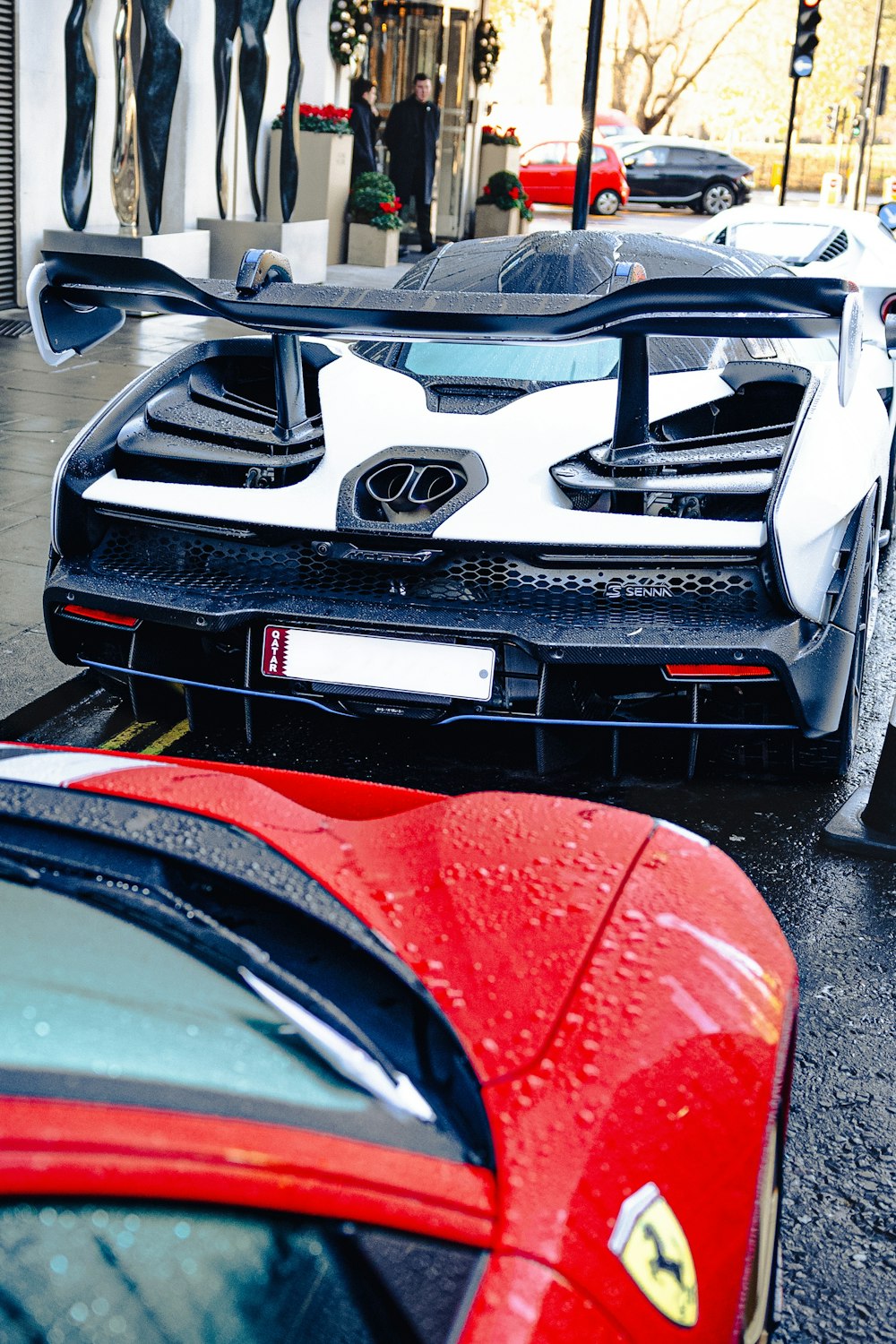 a couple of sports cars parked next to each other