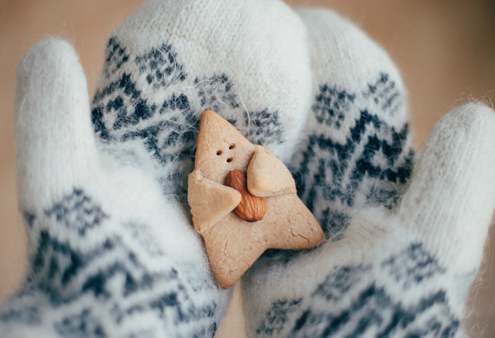 a close up of a person's hand holding a cookie