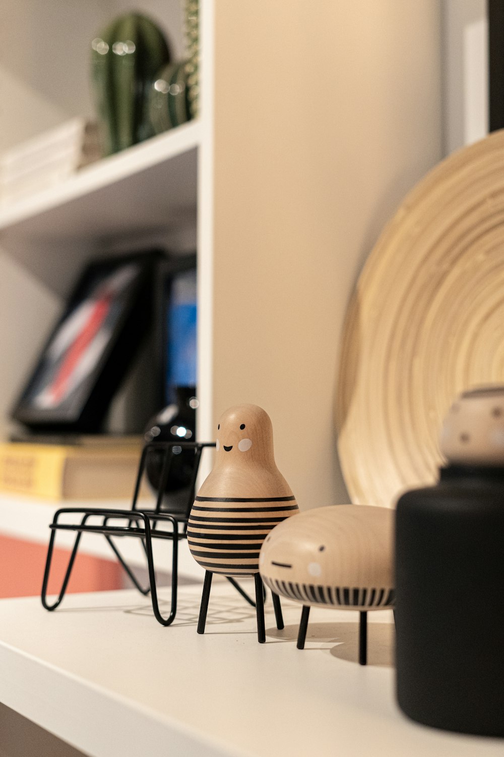 a close up of a shelf with a vase