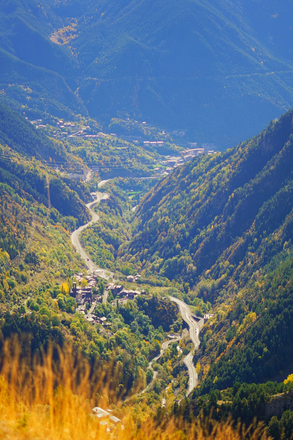 a view of a winding road in the mountains