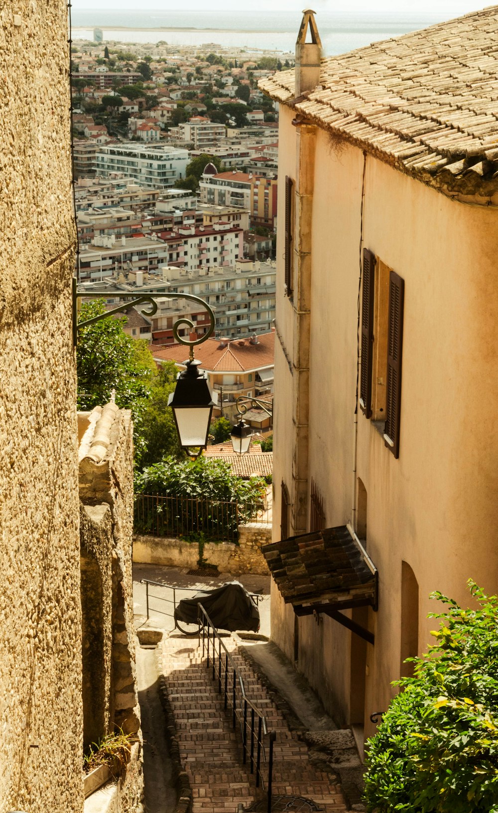 a view of a city from an alley way