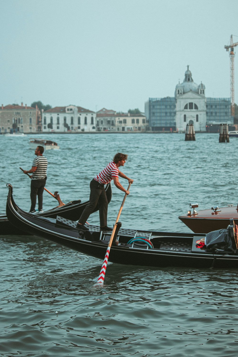 a couple of people riding on the back of a boat