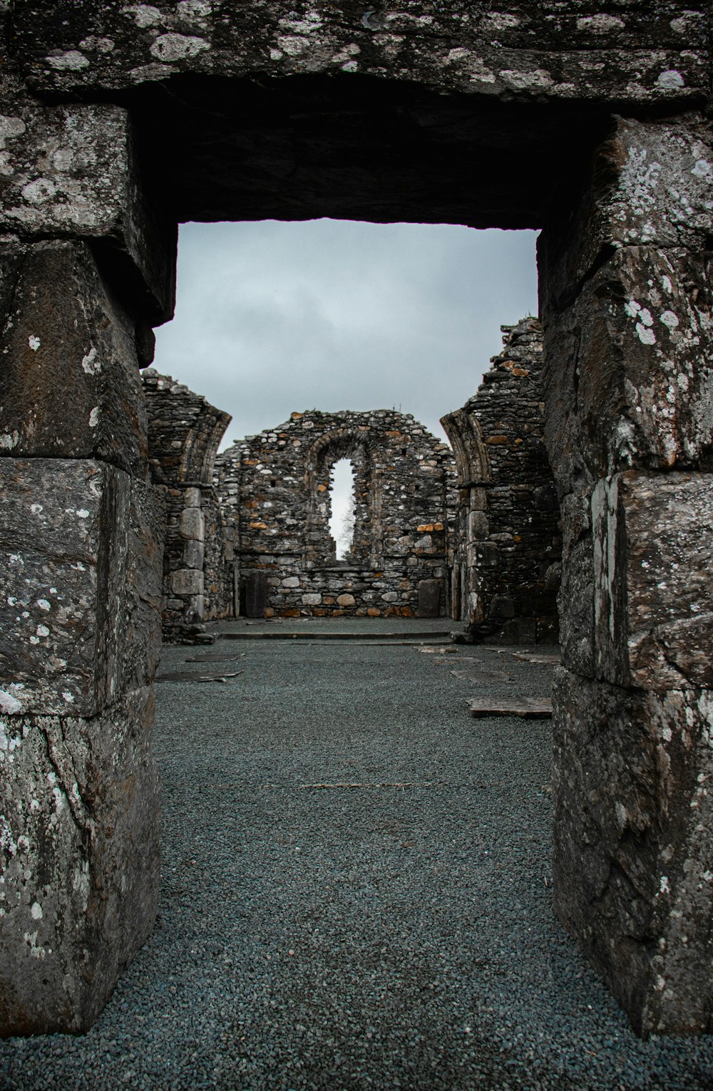 a stone building with a window in the middle of it