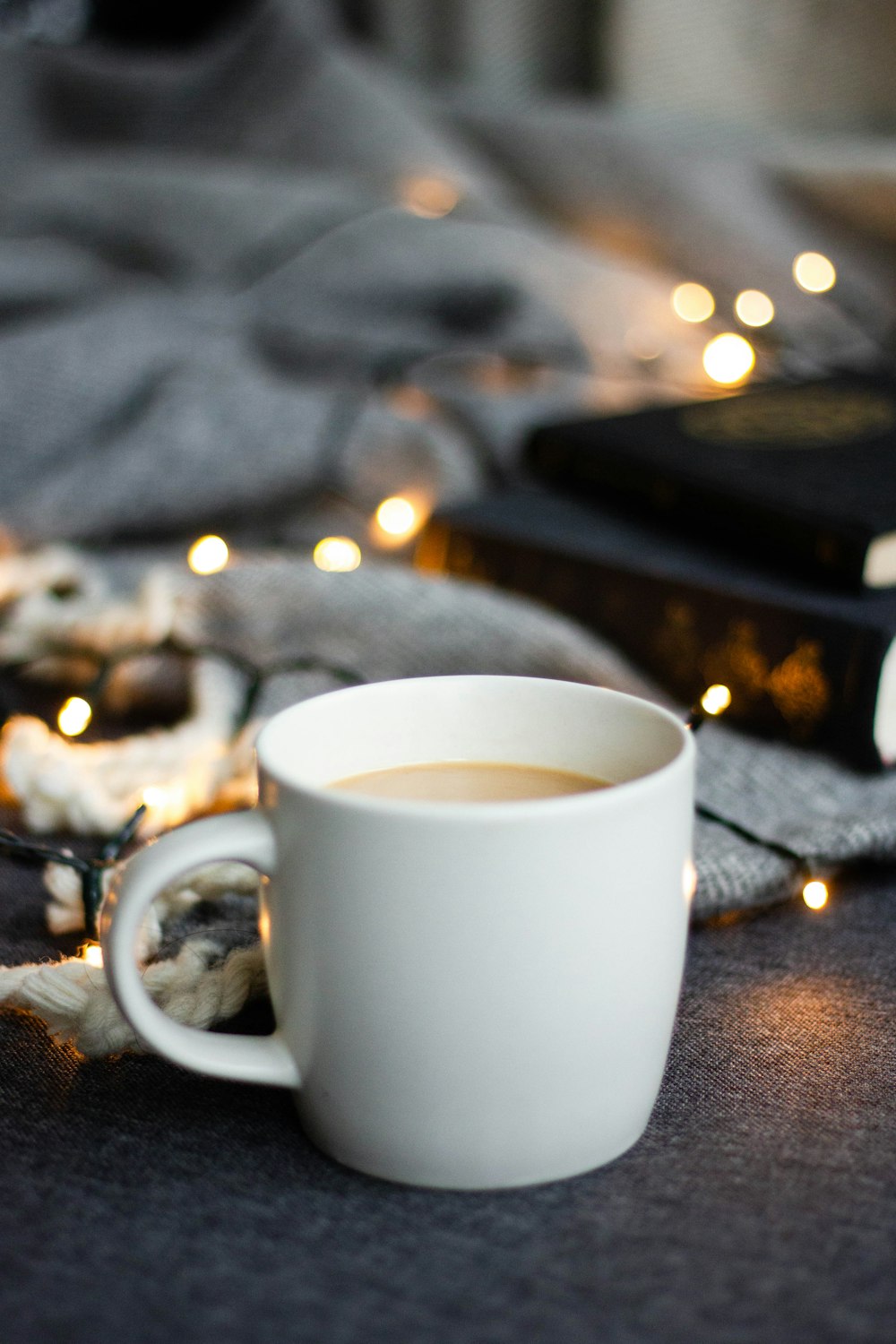 a cup of coffee sitting on top of a table