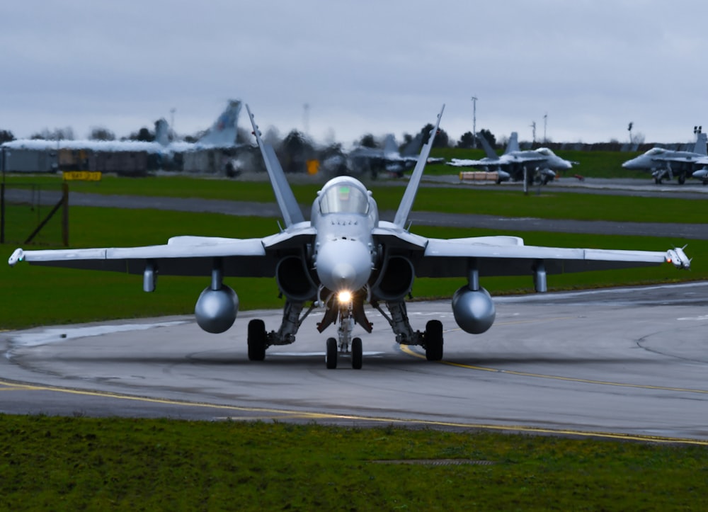 a fighter jet taking off from an airport runway