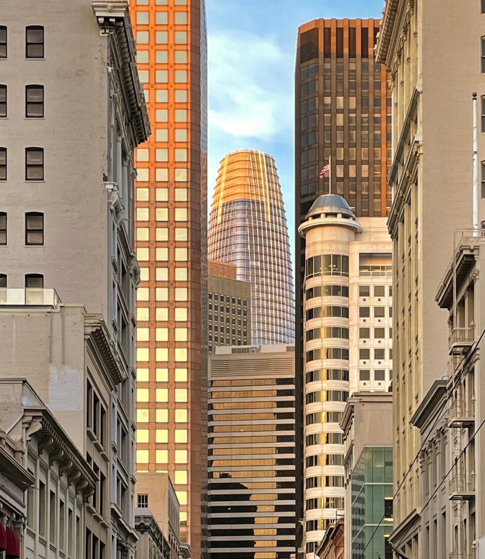 a city street filled with traffic and tall buildings