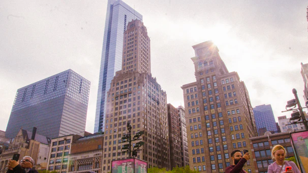 Colorful cityscape from a vibrant mobile game showing lively streets and growing skyscrapers.